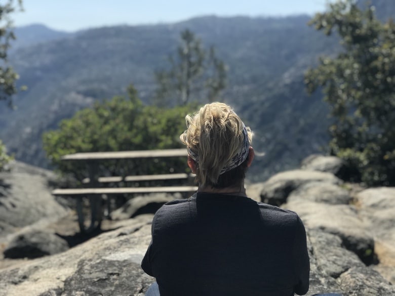 Zanne from WhereGalsWander sits and admires the views from Hetch Hecht in Yosemite National Park, California